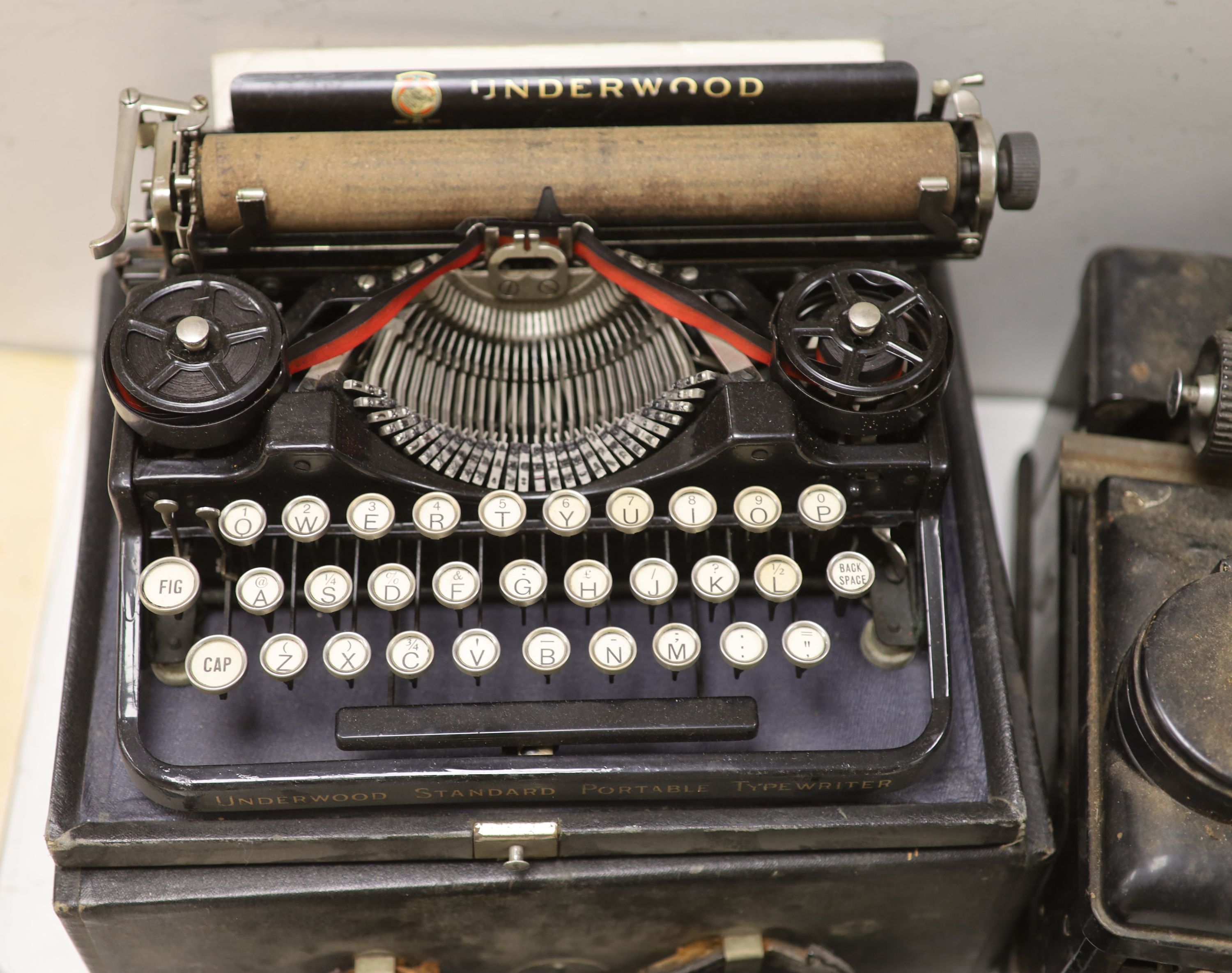 Three vintage typewriters: Underwood Standard portable, Remington Portable and Royal Typewriter Company